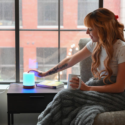 Girl tapping a LuvLink Friendship Lamp