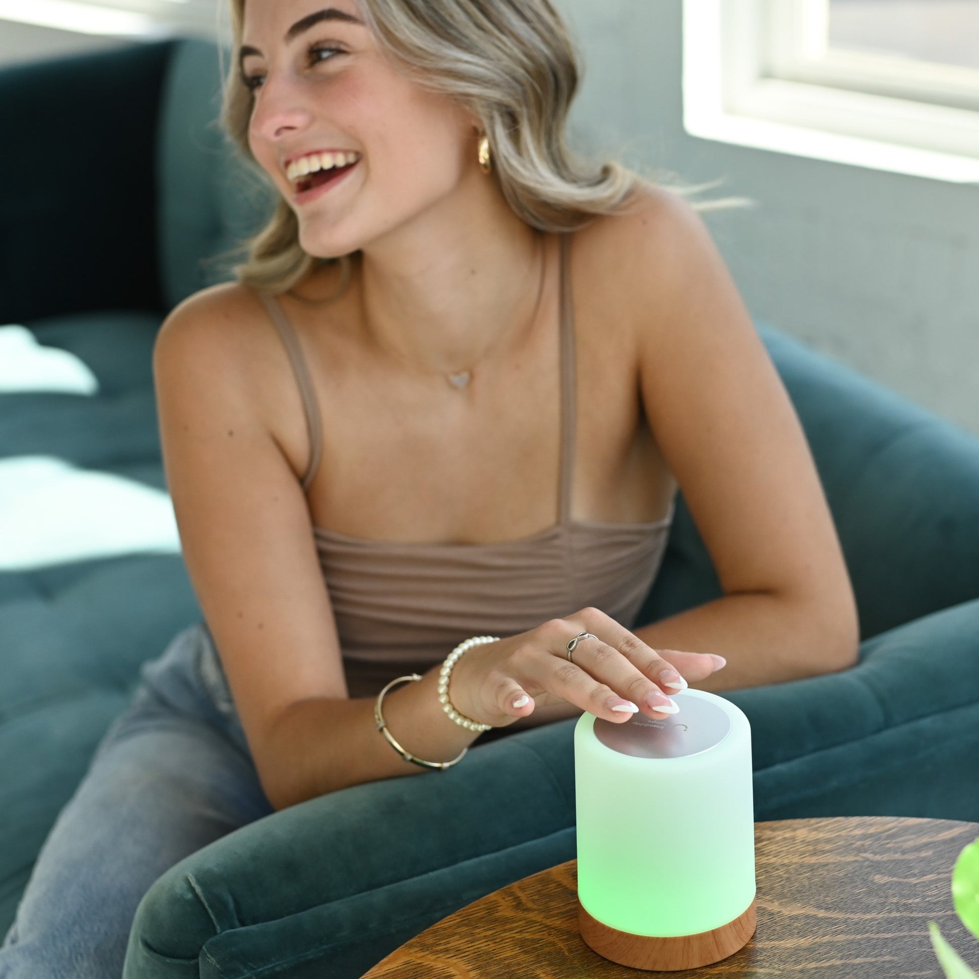 Girl tapping the Friendship Lamps